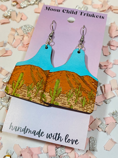 Desert Nature Scene Cow Tag Hand Painted Wood Dangle Earrings