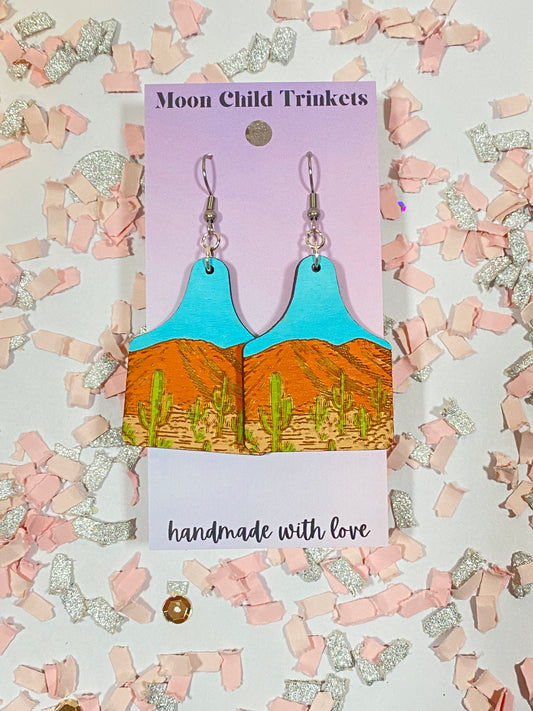 Desert Nature Scene Cow Tag Hand Painted Wood Dangle Earrings